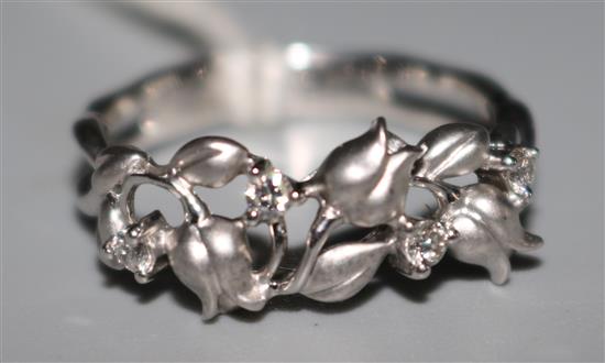 An 18ct white gold and diamond floral design ring, size L.